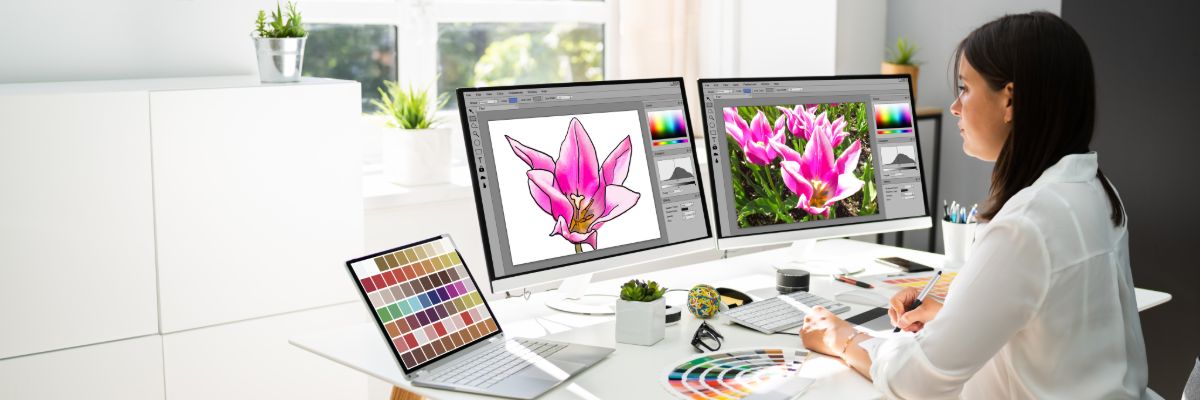 Custom website design displayed on multiple computer screens
